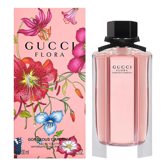 Gucci Flora perfume bottle and packaging with floral design on a pink background